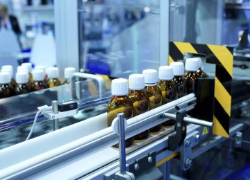 Factory for the production of medicines, glass bottles on the conveyor